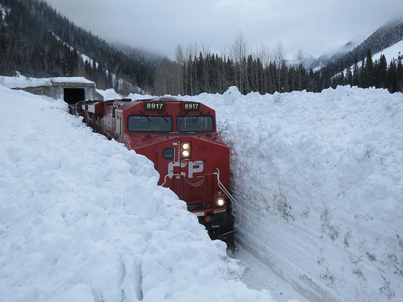 train-going-through-huge-snow-wall-in-canada.jpg